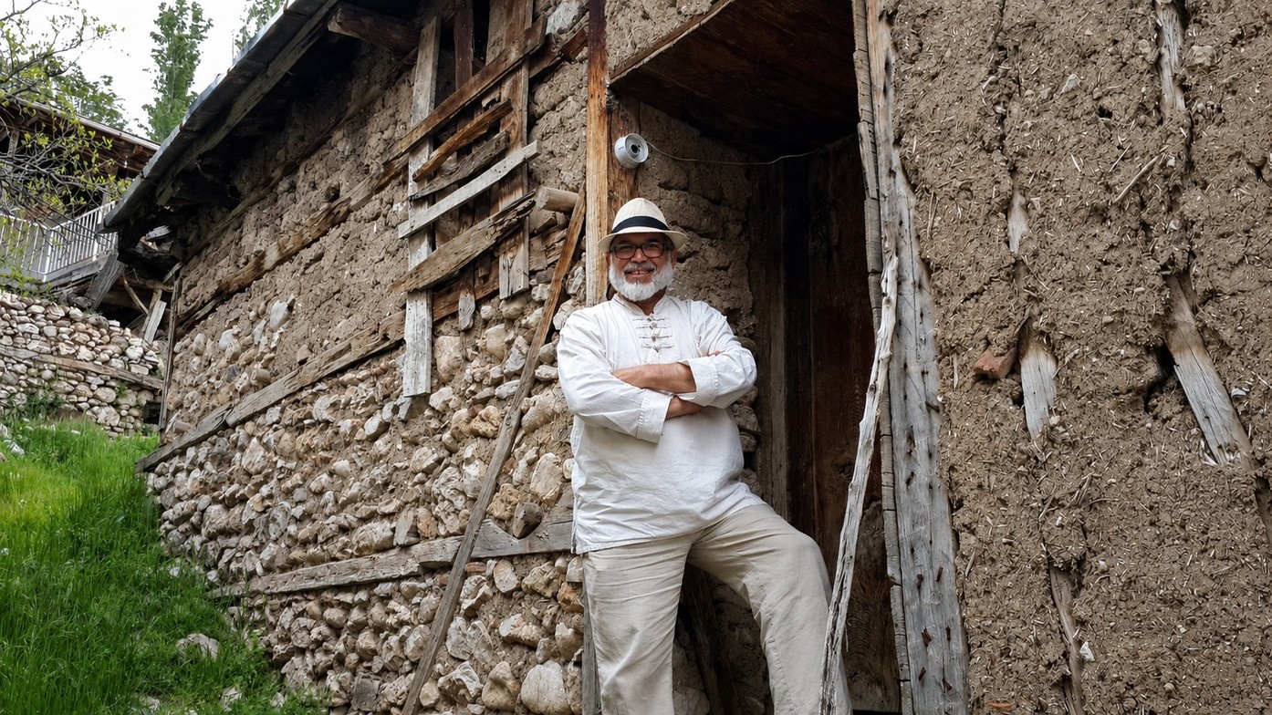Yousef Ahadi standing at the threshold of the old family home.